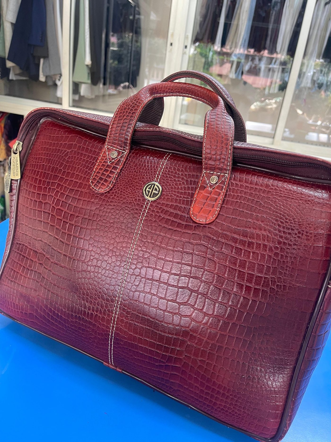 Prince leather care work on a leather bag